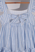 Load image into Gallery viewer, Blue and white striped dress with a bow detail on a hanger.