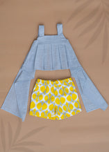 Load image into Gallery viewer, A set of Pure Cotton Pleated Top and Shorts for baby girl dresses kept on a beige colored background