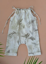 Load image into Gallery viewer, An organic cotton jumpsuit eco-printed with silver oak leaves with some leaves aside.