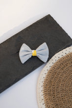 Load image into Gallery viewer, A Cotton Bow Hair Clip kids hair accessories kept on a black surface