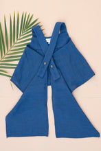 Load image into Gallery viewer, Backside view of a beautiful Pure Cotton Indigo coloured Pleated Top for kidswear placed on a peach background with a leaf aside