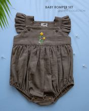 Load image into Gallery viewer, A cute baby romper kept on a blue background with a leaf aside.
