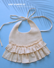Load image into Gallery viewer, A beautiful cream flare bib kept on a blue background.