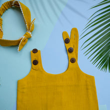 Load image into Gallery viewer, A beautiful deep yellow extendable shift dress with matching hair accessory with leaf aside.