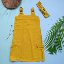 Load image into Gallery viewer, A beautiful deep yellow extendable shift dress with matching hair accessory with wooden, two bi needles and leaf aside.