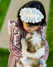 Load image into Gallery viewer, A girl wearing beautiful lace shift dress with matching accessory posing with puppy in the middle of the road.
