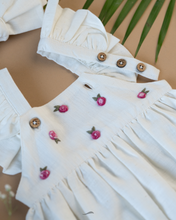 Load image into Gallery viewer, A cute romper with some flower embroidery on it with matching hair accessory, some leaf and flower aside.