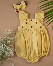 Load image into Gallery viewer, A cute romper with some strawberry embroidery on it with matching hair accessory, some leaf and flower aside.