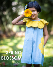 Load image into Gallery viewer, A girl holding flower and posing it by wearing a beautiful dress with petal detailing's around the neck and pockets.
