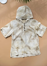 Load image into Gallery viewer, A unisex hooded kurta eco-printed using silver oak leaves kept upon a peach background.
