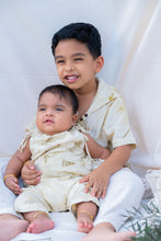 Load image into Gallery viewer, A boy holding a small kid where both are wearing a unisex hooded kurta eco-printed using silver oak leaves.
