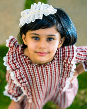 Load image into Gallery viewer, A girl wearing beautiful lace shift dress with matching accessory posing in the middle of the road.
