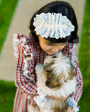 Load image into Gallery viewer, A girl wearing beautiful lace shift dress with matching accessory posing with puppy in the middle of the road.
