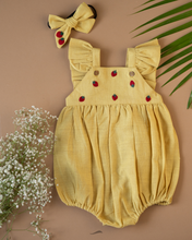 Load image into Gallery viewer, A cute romper with some strawberry embroidery on it with matching hair accessory, some leaf and flower aside.
