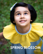 Load image into Gallery viewer, A girl posing by wearing a beautiful dress with petal detailing&#39;s around the neck and pockets.
